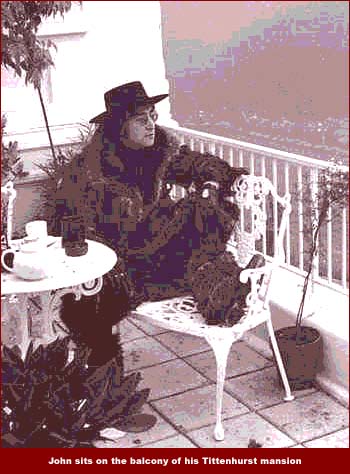 John Lennon sits on the balcony of his Tittenhurst mansion outside of London, England. John Lennon lived here with Yoko Ono in the early 1970s and when he and Yoko moved to New York City, he sold the property to fellow Beatle, Ringo Starr.