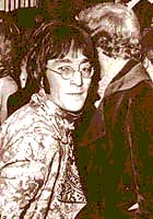 John Lennon at a gala opening with his friend Pete Shotton