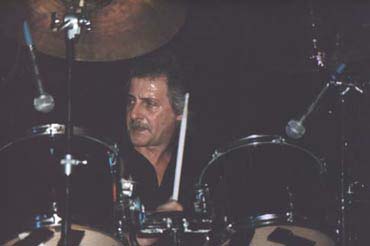 Pete Best plays drums at a fan convention in the 1990s