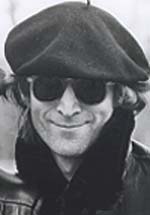 John Lennon gives a rye smile in November 1980